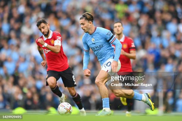 Jack Grealish of Manchester City in action with Bruno Fernandes of Manchester United during the Premier League match between Manchester City and...