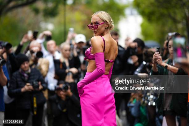 Christine Bently aka Christine Quinn wears neon pink cat eyes sunglasses, a neon pink sequined bra underwear, neon pink high gloves, high waist neon...