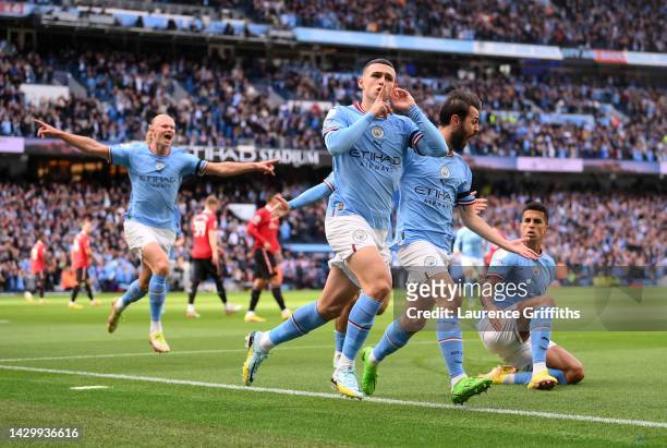 Phil Foden of Manchester City celebrates their sides first goal during the Premier League match between Manchester City and Manchester United at...