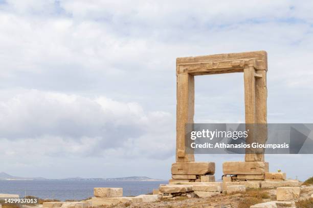 The ruins of Apollo Temple or Portara on September 27, 2022 in Santorini, Greece. Naxos Temple of Apollo is a huge marble gate and the single...