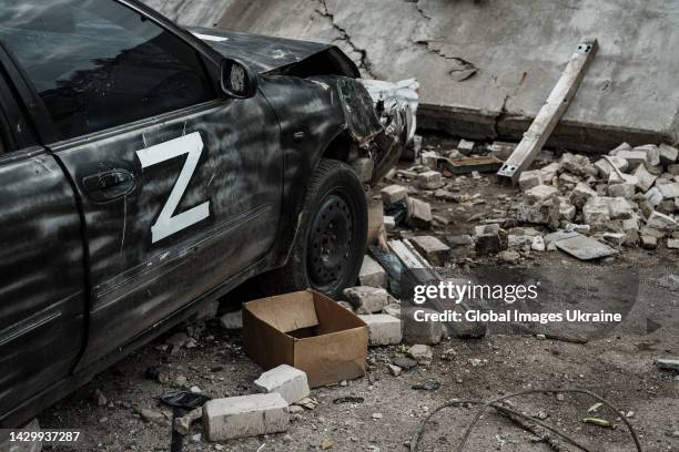 Wreckage of a car marked with Russian military symbol “Z” stands at Russian military base, which Ukrainian Forces destroyed by HIMARS during a...