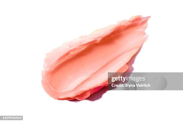 beauty cosmetic product texture of delicate pink smear  - pink red coral color hair mask or facial cream,  hand cream, bb face cream. - coral colored photos et images de collection