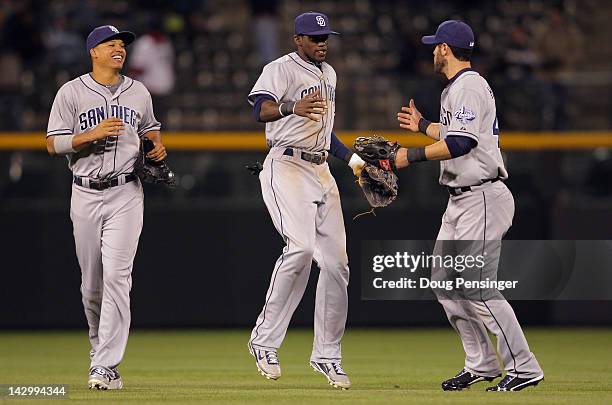 Outfielders Will Venable, Cameron Maybin and Jeremy Hermida of the San Diego Padres celebrate their 7-1 win over the Colorado Rockies at Coors Field...