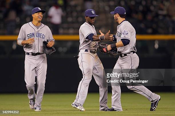 Outfielders Will Venable, Cameron Maybin and Jeremy Hermida of the San Diego Padres celebrate their 7-1 win over the Colorado Rockies at Coors Field...