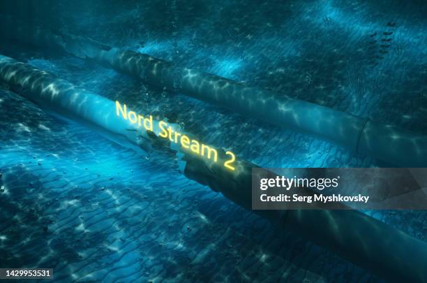 close-up of the destroyed nord stream 2 oil pipeline underwater. - burst pipes stock-fotos und bilder