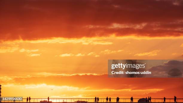 watching the sun go down - city of london stock pictures, royalty-free photos & images
