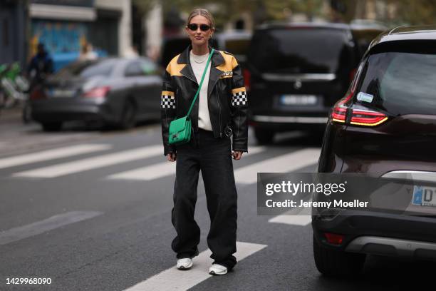 Emili Sindlev seen wearing an Hermes Constance green leather bag, outside Vivienne Westwood during Paris Fashion Week on October 01, 2022 in Paris,...