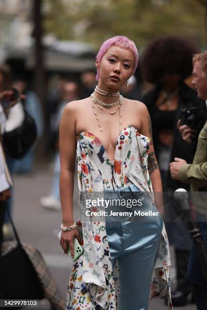 Mia Kong seen wearing Vivienne Westwood pearl necklace, outside Vivienne Westwood during Paris Fashion Week on October 01, 2022 in Paris, France.