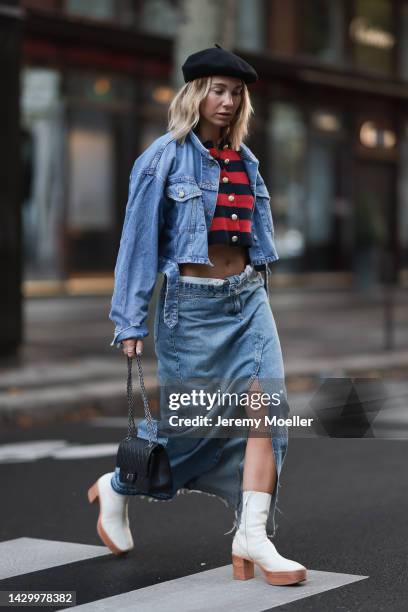 Karin Teigl wearing Zara long denim skirt, Zara jeans jacket, white H&M Studio shoes, Chanel 2.55 black leather bag, striped Zara cardigan during...