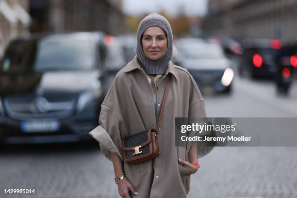 Sue Giers wearing SoSue balaclava knit beige, brown Celine bag and beige The Frankie Shop jacket during Paris Fashion on October 02, 2022 in Paris,...