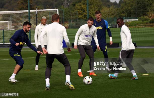 Hugo Lloris, Pierre-Emile Hojbjerg and Yves Bissouma of Tottenham Hotspur during a training session at Tottenham Hotspur Training Centre ahead of...