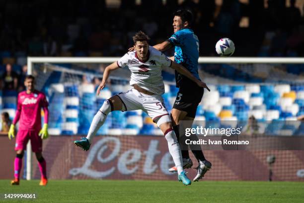 Kim Min-Jae of SSC Napoli and Aleksey Miranchuk of Torino FC jump for the ball during the Serie A match between SSC Napoli and Torino FC at Stadio...