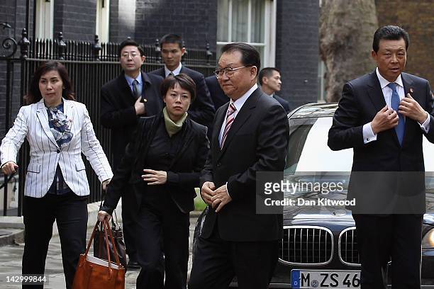 Li Changchun Of The Chinese Communist Party and his entourage arrive at 10 Downing Street on April 17, 2012 in London, England. Mr Chanchun is due to...