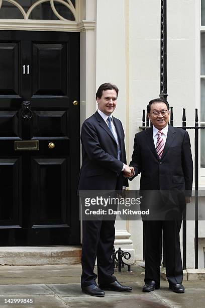 Li Changchun Of The Chinese Communist Party is greeted by Chancellor of the Exchequer George Osborne in Downing Street on April 17, 2012 in London,...