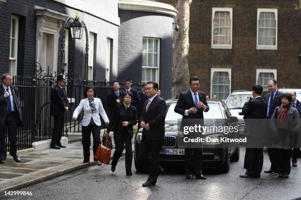 Li Changchun Of The Chinese Communist Party and his entourage arrive at 10 Downing Street on April 17, 2012 in London, England. Mr Chanchun is due to...