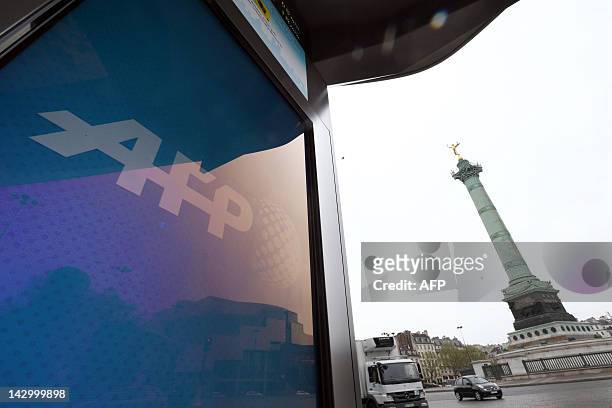 Picture taken on April 17, 2012 shows a screen of the "Concept Abribus" bus shelter on the Bastille Square in Paris, by France's JC Decaux, the...