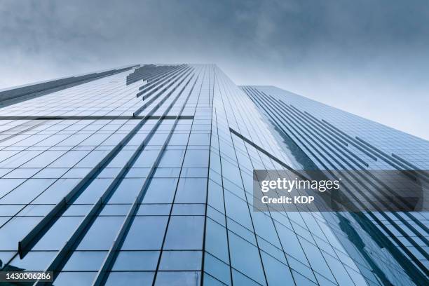 low angle view of skyscraper building and modern architecture facade - capitalismo foto e immagini stock