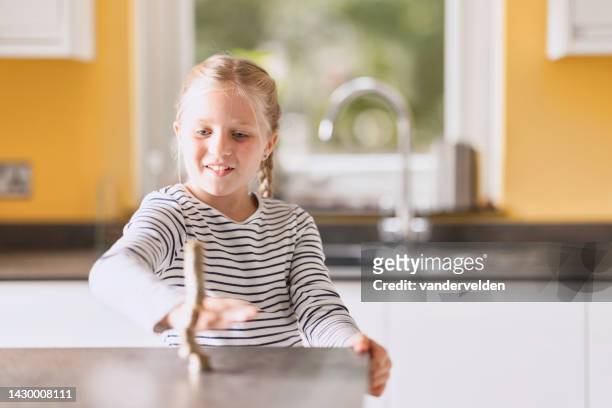 eight-year-old girl with long, fair hair - kid looking down stock pictures, royalty-free photos & images