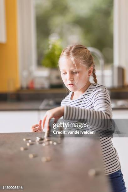 eight-year-old girl with long, fair hair - allowance stock pictures, royalty-free photos & images