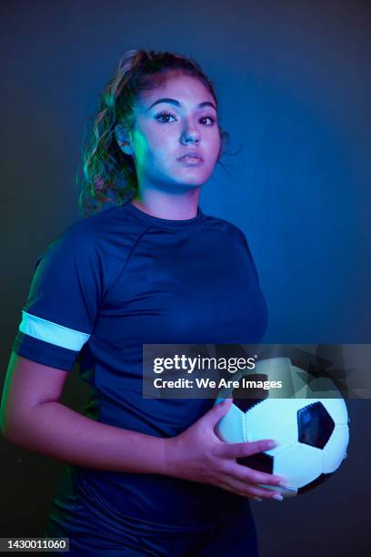 portrait of female footballer - gel effect lighting stock pictures, royalty-free photos & images