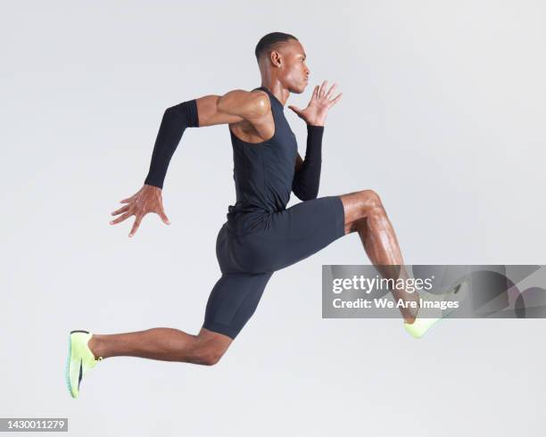 athlete running - effortless experience stock pictures, royalty-free photos & images