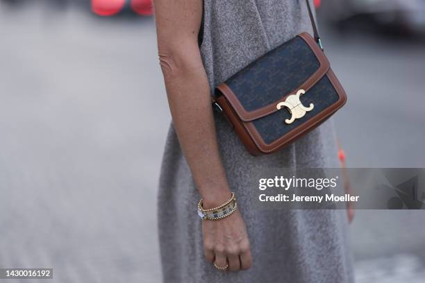 Sue Giers wearing SoSue knit beige dress, brown Celine bag during Paris Fashion on October 02, 2022 in Paris, France.