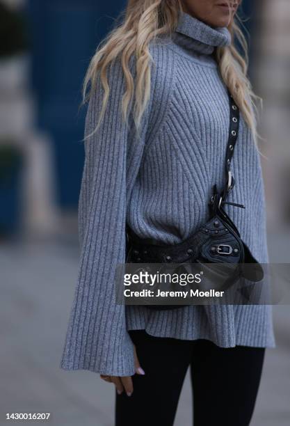 Sue Giers wearing SoSue grey sweater, black Balenciaga Le Cagole bag and black SoSue leggings during Paris Fashion on October 02, 2022 in Paris,...