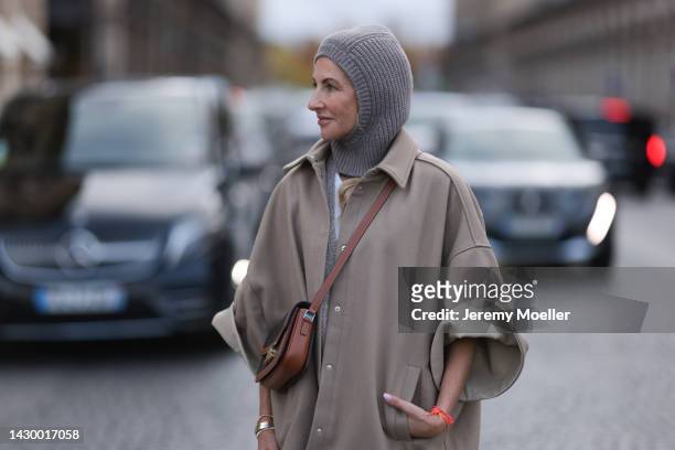 Sue Giers wearing SoSue balaclava knit beige, brown Celine bag and beige The Frankie Shop jacket during Paris Fashion on October 02, 2022 in Paris,...