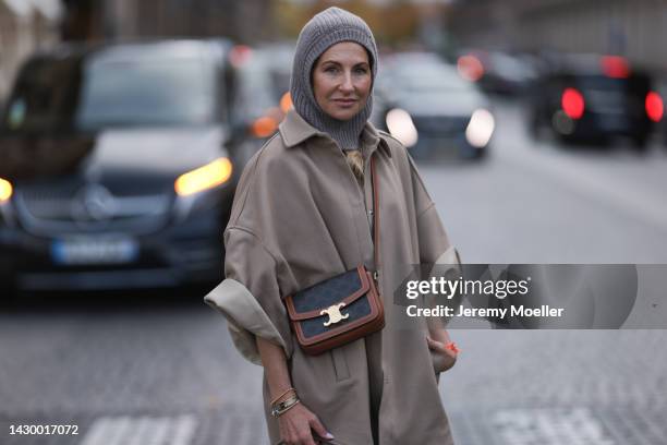 Sue Giers wearing SoSue balaclava knit beige, brown Celine bag and beige The Frankie Shop jacket during Paris Fashion on October 02, 2022 in Paris,...