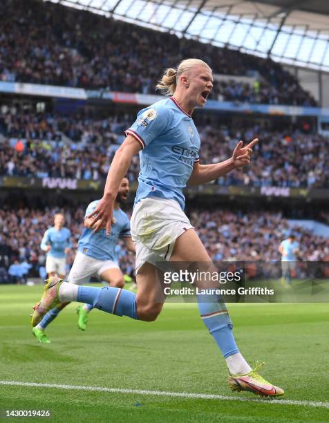 Erling Haaland of Manchester City celebrates their sides third goal during the Premier League match between Manchester City and Manchester United at...
