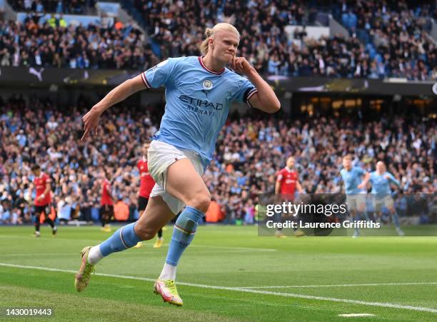 Erling Haaland of Manchester City celebrates their sides third goal during the Premier League match between Manchester City and Manchester United at...