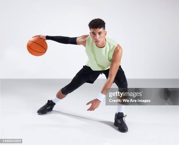 man playing with basketball - dribbling sport foto e immagini stock