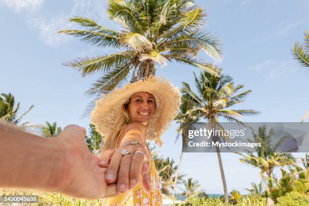 follow me to the tropical beach, woman leading boyfriend to an idyllic destination of travel together pov - caribbean dream stock pictures, royalty-free photos & images