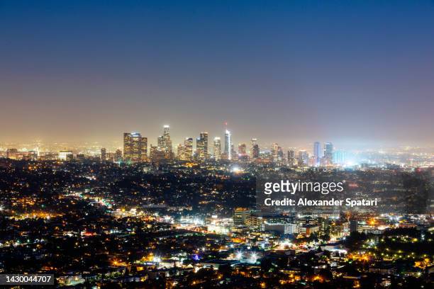 los angeles downtown skyscrapers illuminated at night, california, usa - beverly hills california stock pictures, royalty-free photos & images