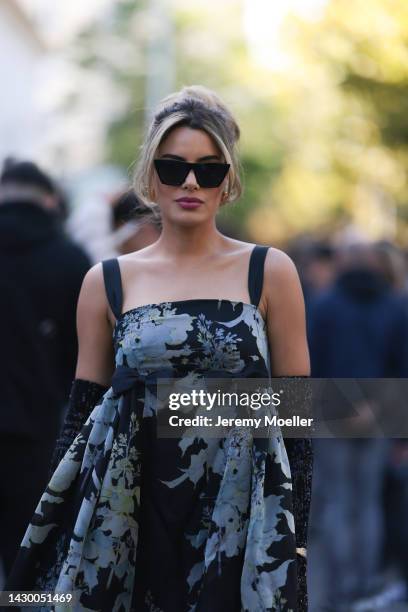 Ariadna seen wearing a blue and black dress, matchy Dior bag and sunglasses and a silver Cartier Pathere watch outside Ellie Saab during Pariser...