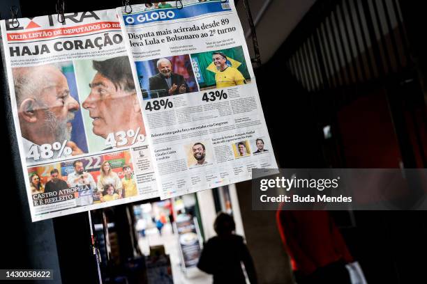 Brazilian newspapers are seen on a newsstand showing headlines a day after the general elections day which confirmed a runoff at the end of the month...