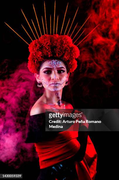 mexican woman dressed as a catrina - flower show stockfoto's en -beelden