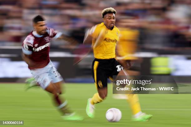 Adama Traore of Wolverhampton Wanderers runs with the ball during the Premier League match between West Ham United and Wolverhampton Wanderers at...
