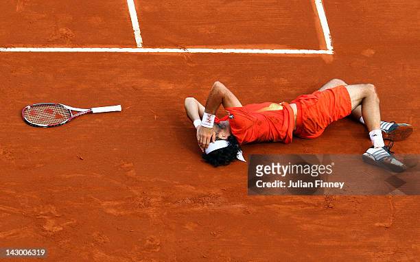 Juan Monaco of Argentina injures himself in his match against Robin Haase of Holland during day three of the ATP Monte Carlo Masters on April 17,...