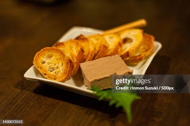 close-up of food in plate on table - バター stockfoto's en -beelden