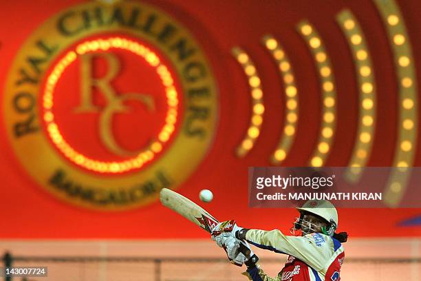 Royal Challengers Bangalore batsman Chris Gayle plays a shot during IPL Twenty20 cricket match between Royal Challengers Bangalore and Pune Warriors...
