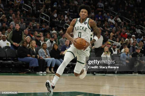 MarJon Beauchamp of the Milwaukee Bucks handles the ball against the Memphis Grizzlies during a preseason game at Fiserv Forum on October 01, 2022 in...