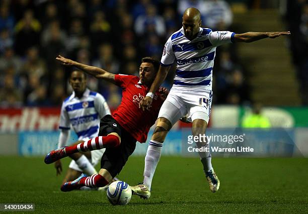 Paul Anderson of Nottingham Forest is tackled by Jimmy Kebe of Reading during the npower Championship match between Reading and Nottingham Forest at...