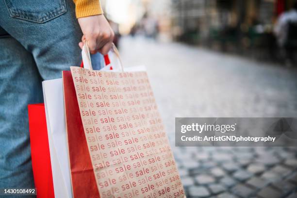 woman with bags from shopping in sale. - black friday sale stock pictures, royalty-free photos & images