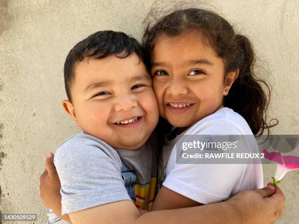 sibling love - brother hug stock pictures, royalty-free photos & images