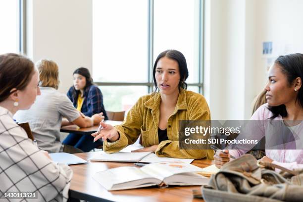 diverse group of students studying - debat stockfoto's en -beelden