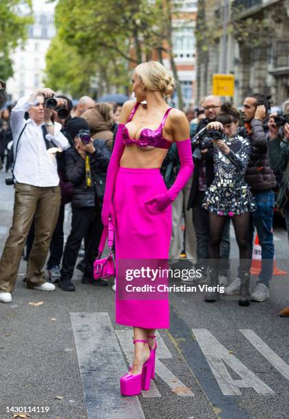 Christine Quinn wears pink top, gloves, skirt outside Valentino during Paris Fashion Week - Womenswear Spring/Summer 2023 : Day Seven on October 02,...