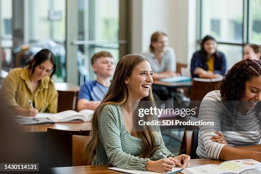 College students taking notes during class College students taking notes during class