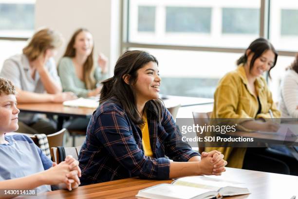 university students take notes and listen to the lecture - secondary school child stock pictures, royalty-free photos & images