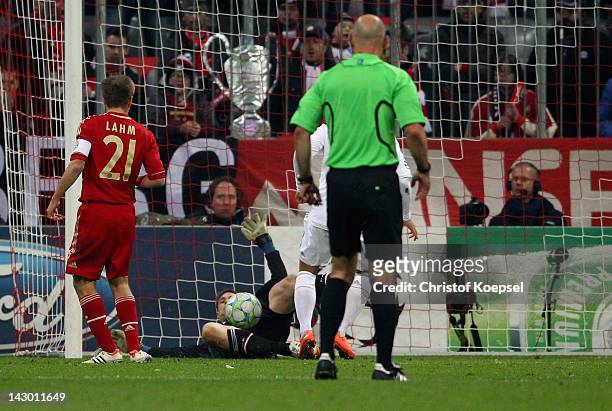 Mesut Oezil of Real Madrid scores the first goal against Manuel Neuer during the UEFA Champions League Semi Final first leg match between FC Bayern...